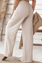 Beige wide-leg pants from Riviera Petal Two Piece Set in lightweight, breathable fabric for comfortable all-day wear.