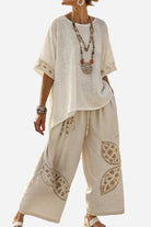 Woman wearing Coastal Comfort Linen two-piece set with lace details and wide-leg pants in beige