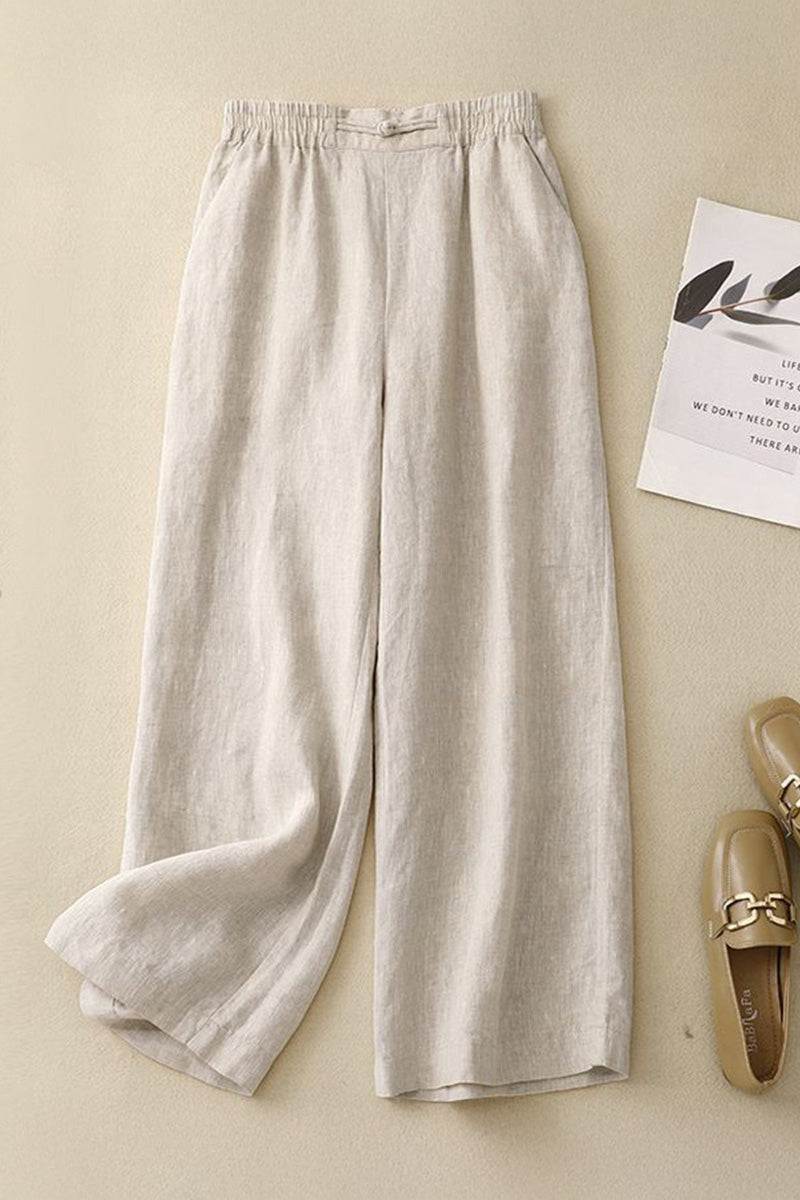 Beige wide-leg trousers made from breathable cotton linen blend fabric with an elastic waistband for comfort