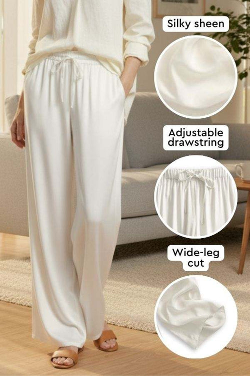 Subtle Moves Silk Wide Leg Trousers in white with silky sheen, adjustable drawstring waist, and wide-leg cut design.