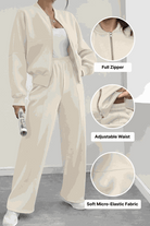 The Voyager Zip Set cream zip-front sweatshirt and wide-leg joggers with adjustable waist and soft micro-elastic fabric for comfortable travel and versatile style