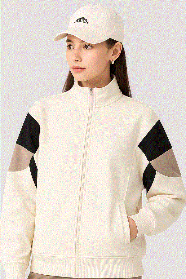 Comfort in Motion lightweight athleisure tracksuit jacket with black and beige sleeve accents, zip-up front, and relaxed sporty fit.
