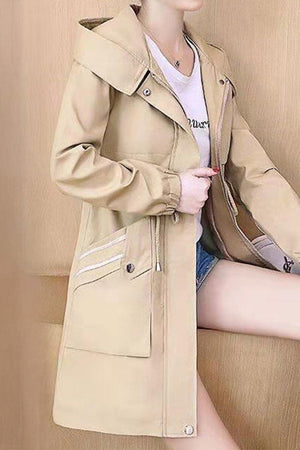 Beige Cityscape Comfort Hooded Windbreaker with mid-length cut and zippered pockets, styled on casual outfit with soft plush interior lining