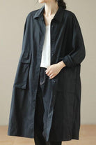 Nomad Ease Oversized Shirt-Jacket black long button-up with roll-up sleeves and large front pockets worn over white top and jeans