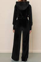 Black velour tracksuit with cropped hoodie and high-waist wide-leg pants, soft and plush texture
