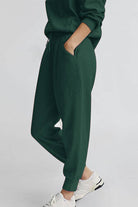 Unisex half-zip pullover and sweatpants set in dark green, lightweight polyester blend, casual and comfortable fit