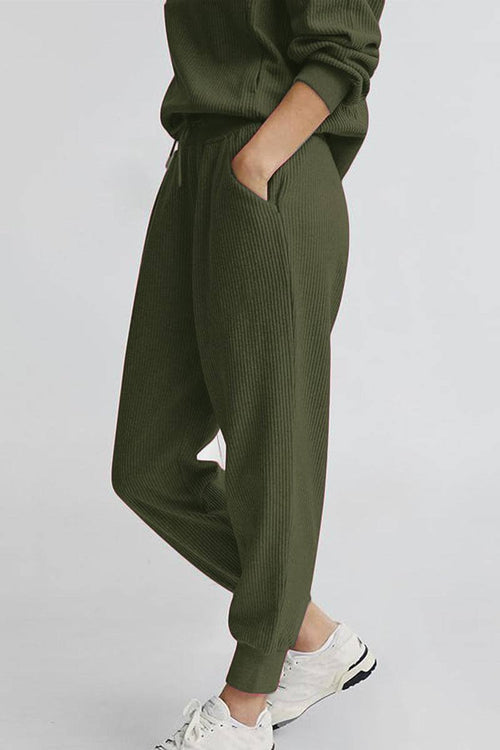 Unisex half-zip pullover and sweatpants set in olive green with a relaxed fit and casual style