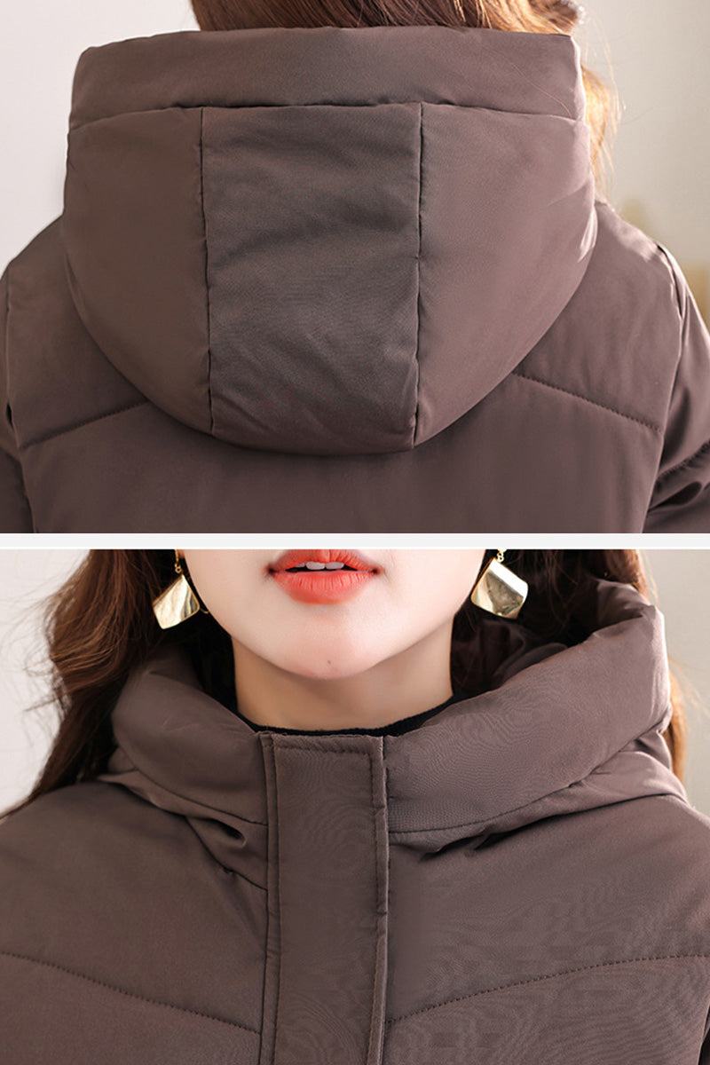 Close-up of the Everyday Warmth Coat's brown hood and collar showing its insulated, wind-resistant fabric and cozy design.