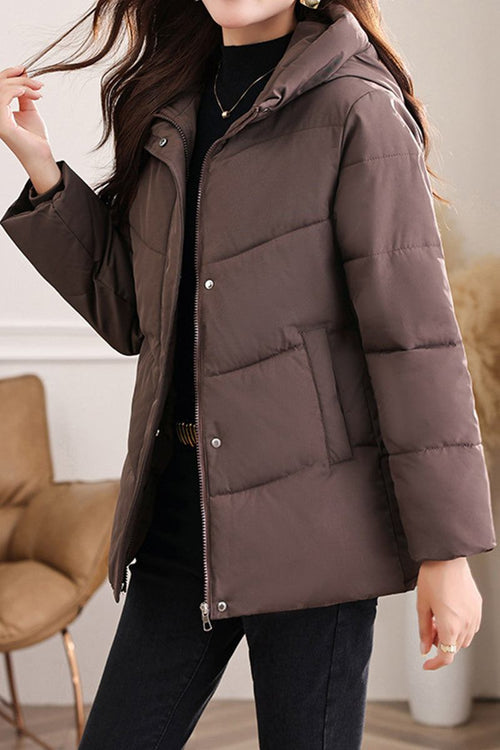 Woman wearing brown Everyday Warmth Coat mid-length hooded lightweight winter jacket with zip and snap buttons.