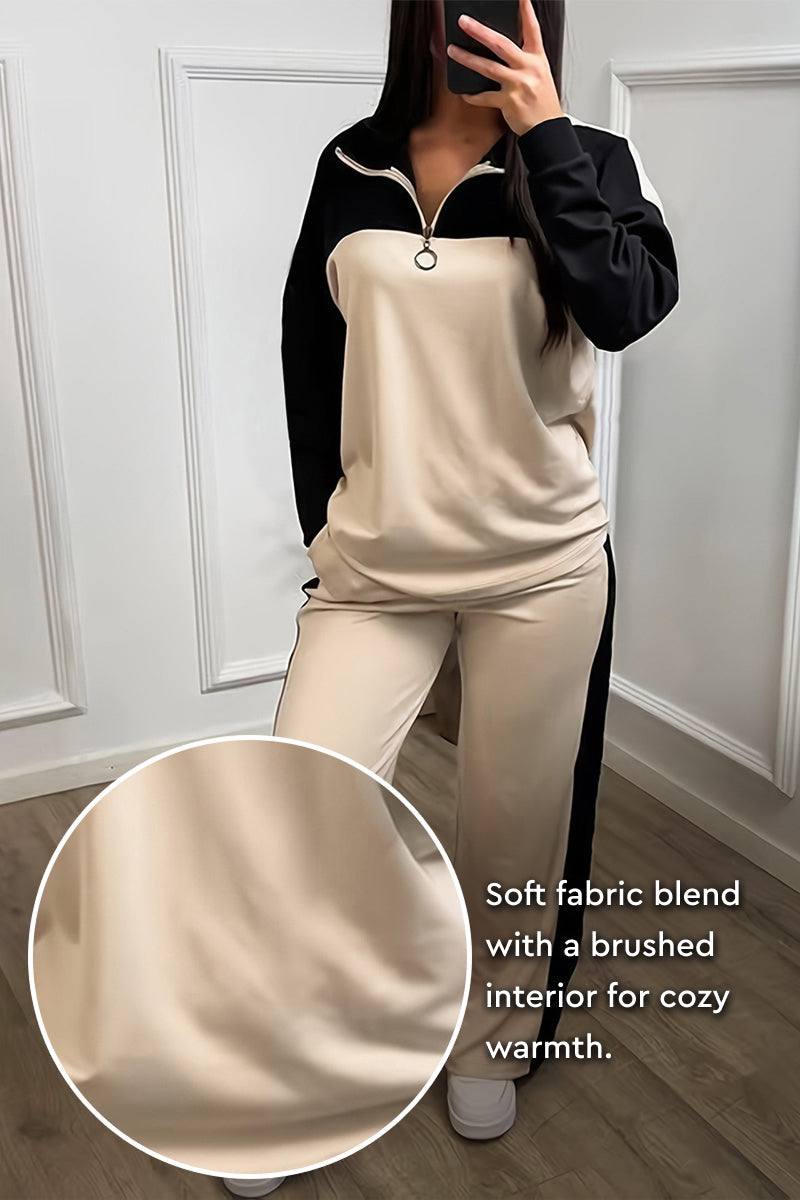 Woman wearing Colorblock Comfort Leisure Set with half-zip top and wide-leg pants in beige and black winter-weight fabric blend
