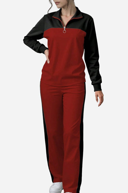 Woman wearing red and black Colorblock Comfort Leisure Set with half-zip top and wide-leg pants