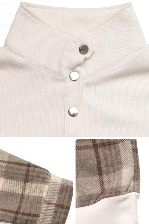 Close-up of waffle knit sweatshirt with button detail and plaid flannel sleeves in neutral tones
