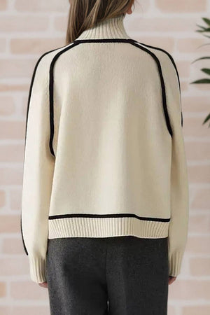 Back view of cream Zero Itch Turtleneck Sweater with black contrast trim and relaxed fit on model