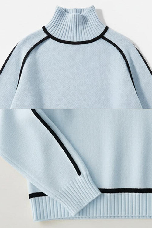 Light blue Zero Itch Turtleneck Sweater with black contrast trim, soft knit, and slimming fit.