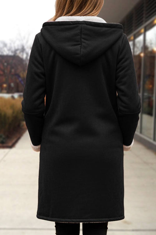Black warm toggle button hooded coat with sherpa lining and faux suede exterior, mid-thigh length winter outerwear.