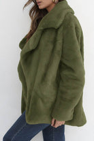 Olive green open front oversized faux fur jacket with draped shawl collar and relaxed fit