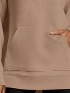 Half-Zip Waffle Pullover with fold-over collar and kangaroo pocket in warm waffle knit texture