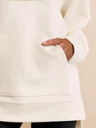 Half-zip waffle pullover with fold-over collar and kangaroo pocket in neutral tone