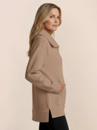 Women wearing a cozy half-zip waffle pullover with a fold-over collar and kangaroo pocket