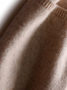 100% Australian Merino Wool long open-front cardigan with front pockets and ribbed cuffs