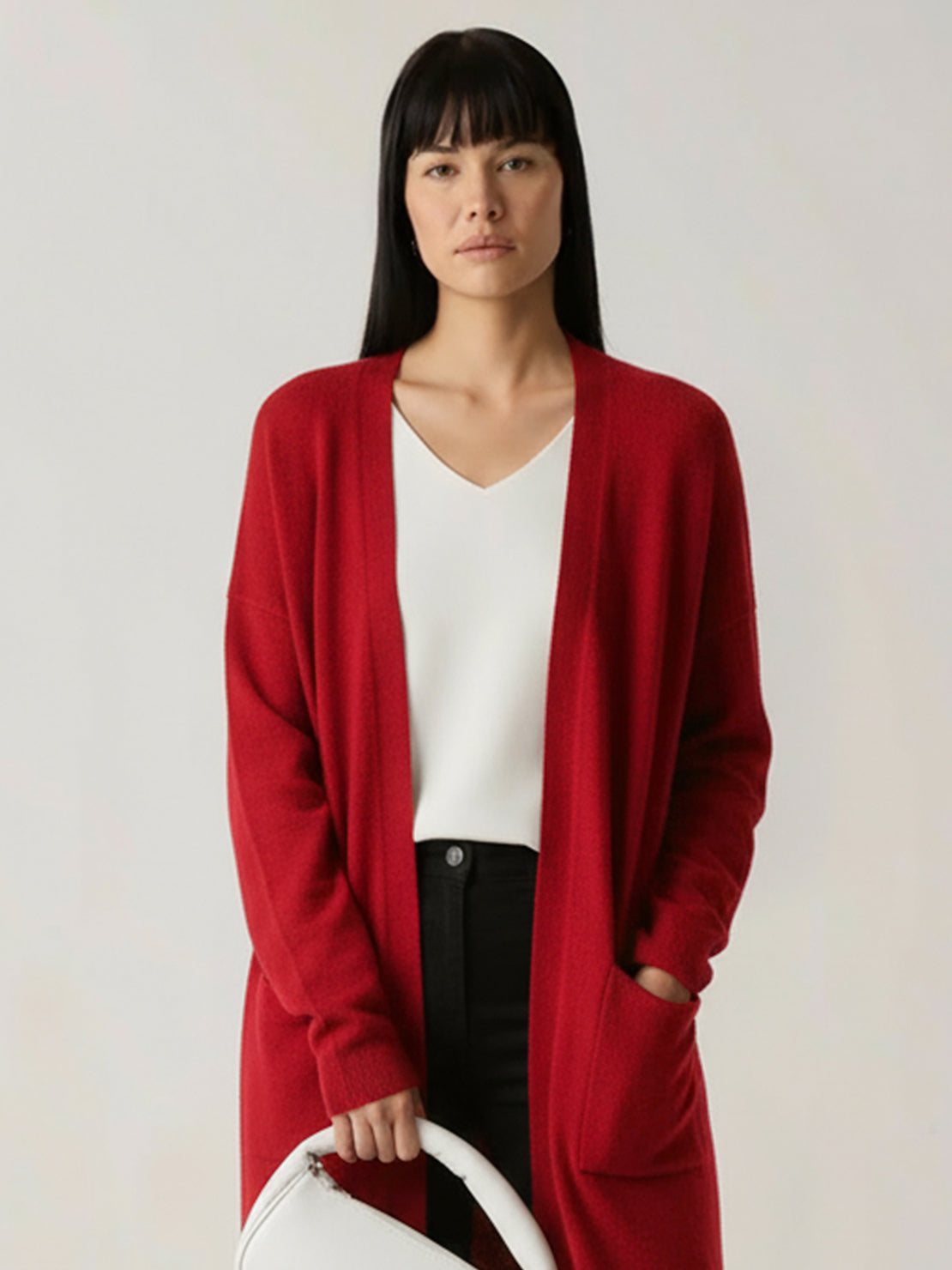Longline open-front cardigan made from 100% Australian Merino Wool with ribbed cuffs and pockets