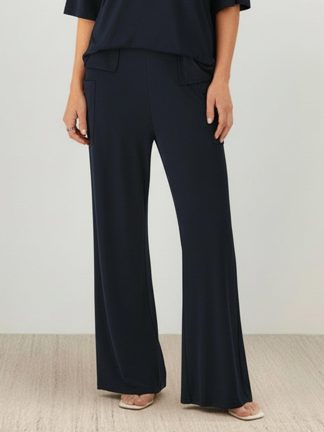 Model wearing oversized long-line loungewear set with oversized pullover and wide-leg pants