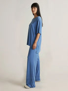 Oversized long-line loungewear set with short-sleeve pullover and wide-leg pants in soft knit fabric