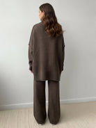soft-knit turtleneck two-piece set with relaxed fit and wide-leg pants made from wrinkle-resistant acrylic knit