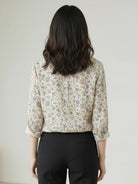 women's floral button-down shirt with long sleeves and relaxed fit