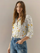 relaxed fit floral button-down shirt with long roll-up sleeves and hip-length hem