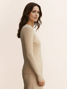 Lightweight 100% cashmere round neck pullover with long sleeves and hip-length cut for versatile styling