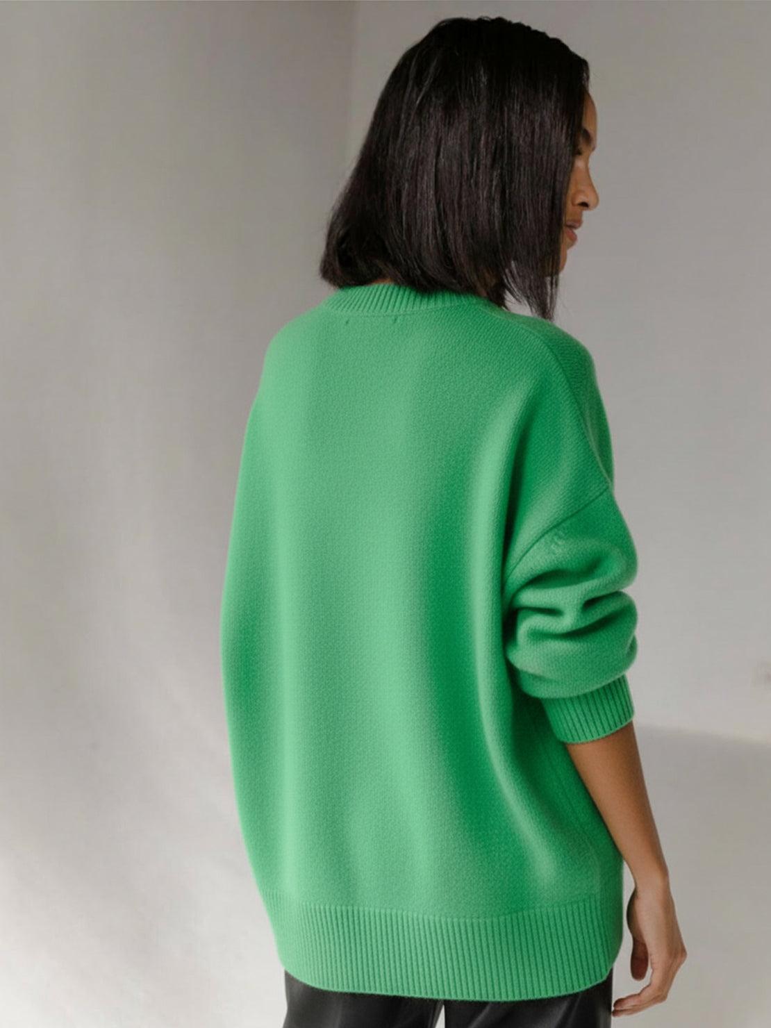 Oversized crew neck knit sweater with drop-shoulder sleeves and ribbed cuffs in neutral color