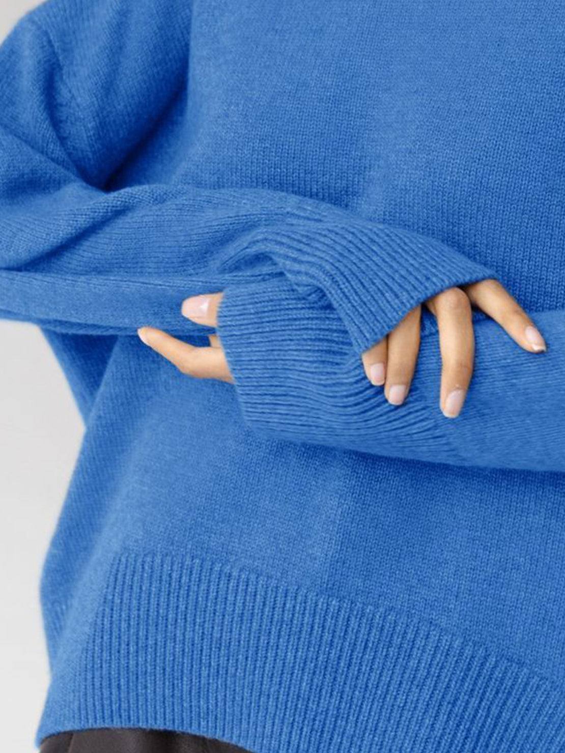 Oversized crew neck knit sweater with dropped shoulders and ribbed cuffs in neutral color