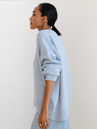 Oversized crew neck knit sweater with drop-shoulder sleeves and ribbed cuffs