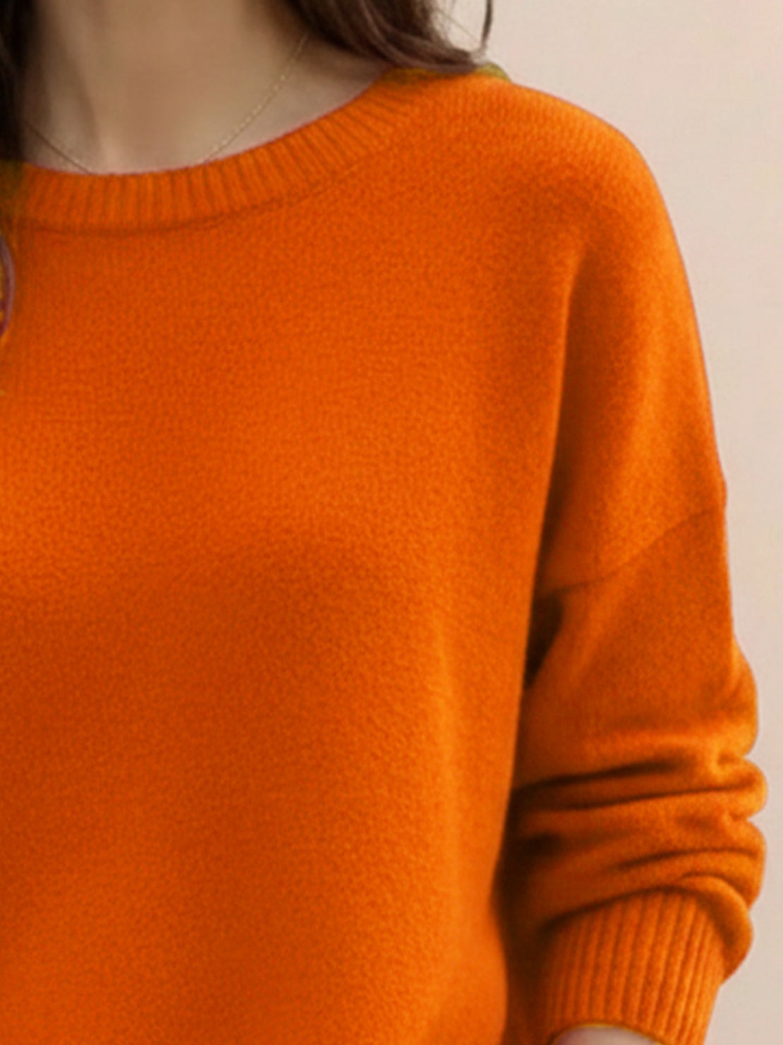 oversized crew neck knit sweater with drop-shoulder sleeves and ribbed cuffs in neutral color