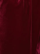 Deep V-neck velvet suit with long sleeves and wide-leg pants in structured flexible fabric