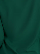 Pleated V-neck long-sleeve blouse with diagonal pleated panel and button cuffs