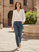 Pleated V-neck long-sleeve blouse with diagonal pleated panel and button cuffs