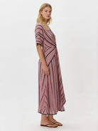 Knot-waist maxi dress with V-neckline, batwing sleeves, and flowing skirt in lightweight fabric
