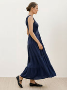 Smocked sleeveless maxi dress with tiered skirt and scoop neckline