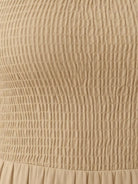 Smocked sleeveless maxi dress with tiered skirt and scoop neckline in lightweight fabric