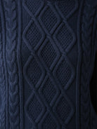 Oversized cable-knit crewneck sweater with dropped shoulders and diamond rope pattern