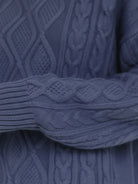 Oversized cable-knit crewneck sweater with dropped shoulders and ribbed trim in thick plush fabric