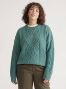 Oversized cable-knit crewneck sweater with dropped shoulders and ribbed trims in thick plush fabric
