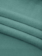 Oversized cable-knit crewneck sweater with dropped shoulders and ribbed trim in thick plush fabric