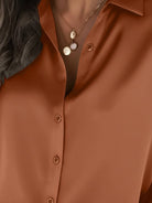 Silk-finish button front shirt with traditional collar and curved hem in smooth polyester blend