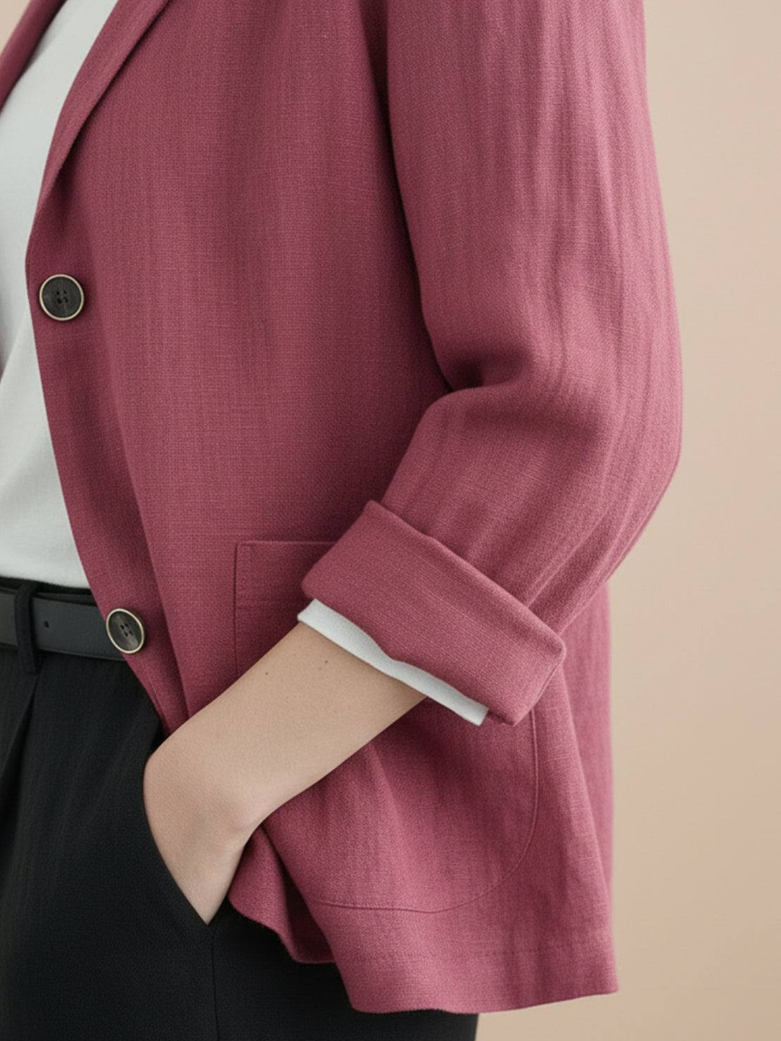 Cotton-linen blazer with relaxed fit, notch lapels, two-button closure, and natural textured fabric