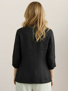 Cotton-linen blazer with notch lapels, two-button front, patch pockets, and relaxed fit in natural textured fabric