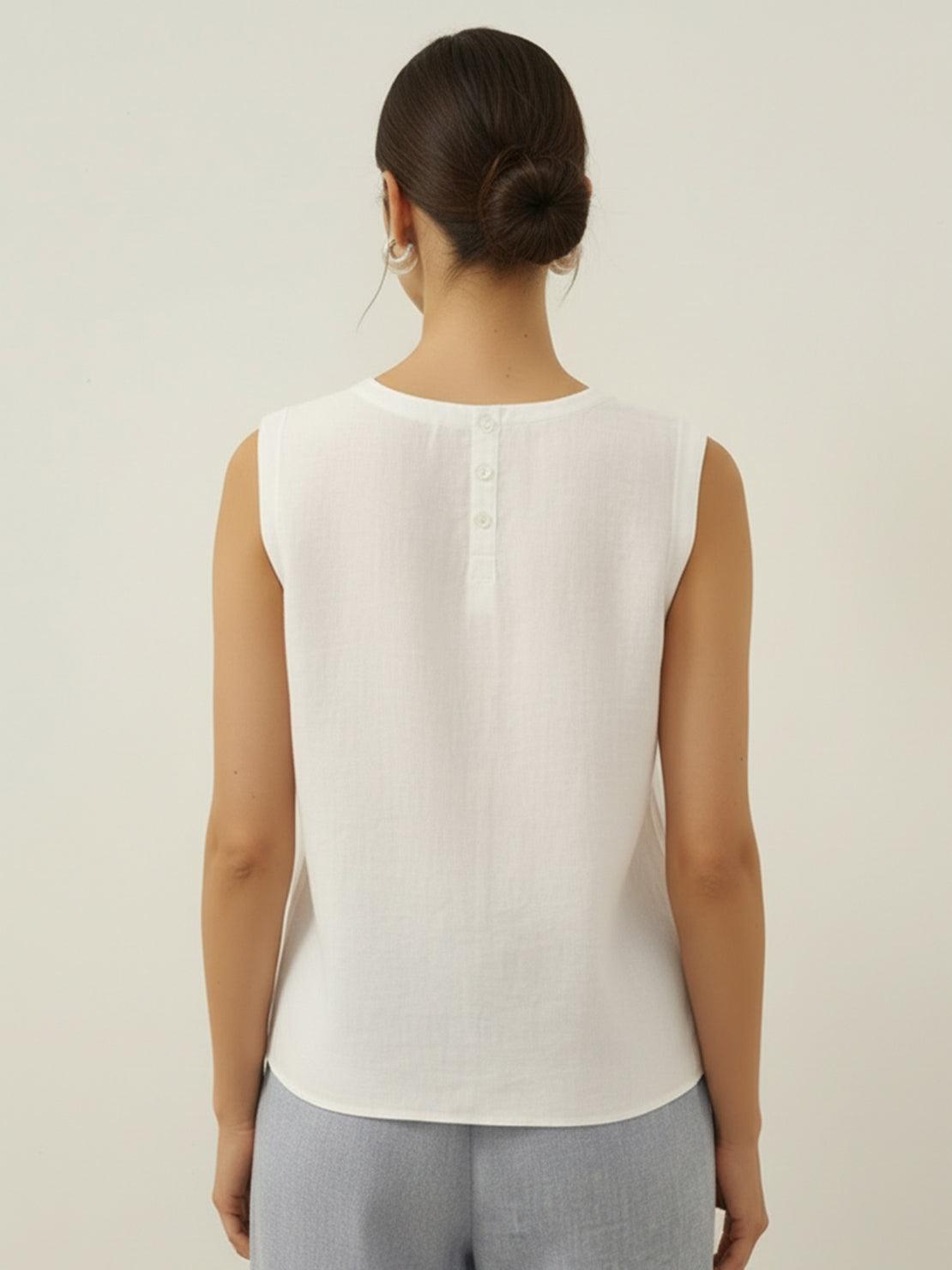 White cotton-linen sleeveless top with round neckline and button back closure