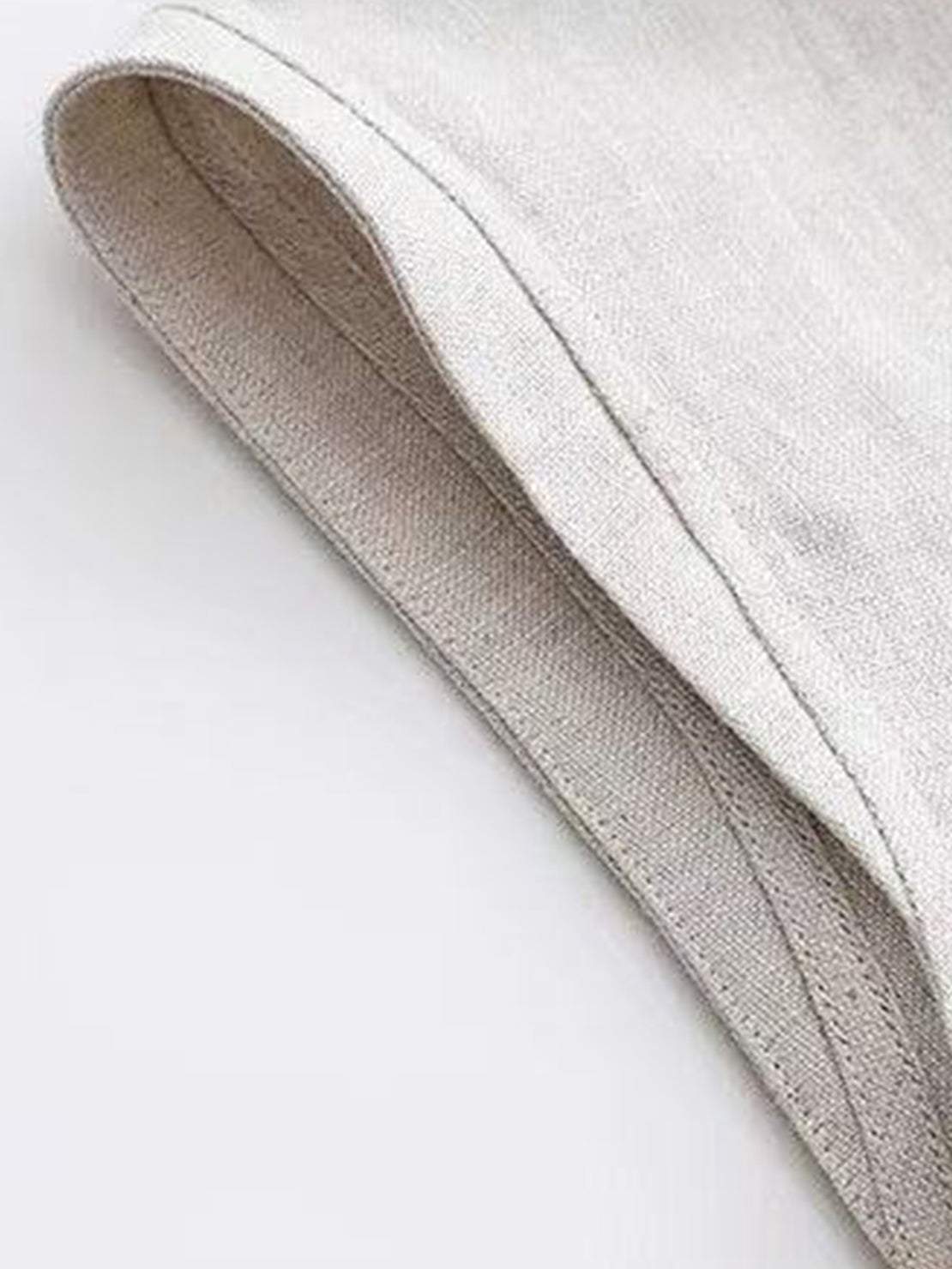 100% cotton-linen sleeveless top with round neckline and back button closure, relaxed A-line fit, hip-length design